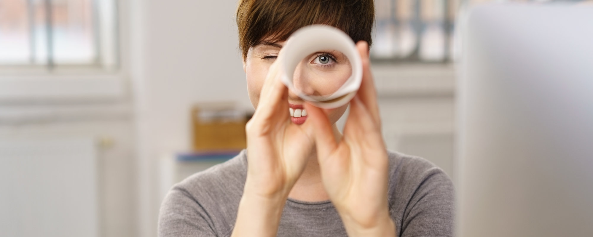 Banner. Lady looking at You with a rolled paper, like with a telescope